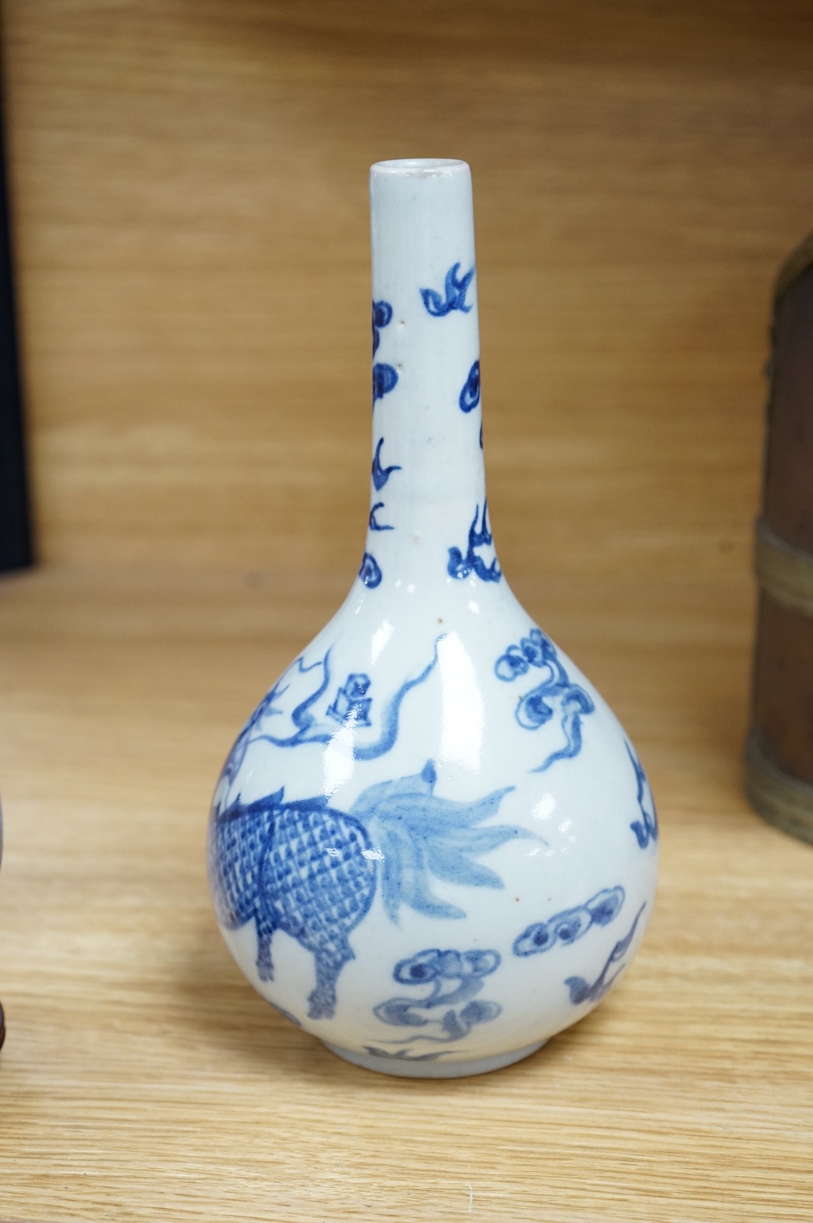 A Chinese blue and white bottle vase, a crackle glaze vase and a Tibetan copper and brass ‘monk’ cap’ ewer (3), tallest 21cm